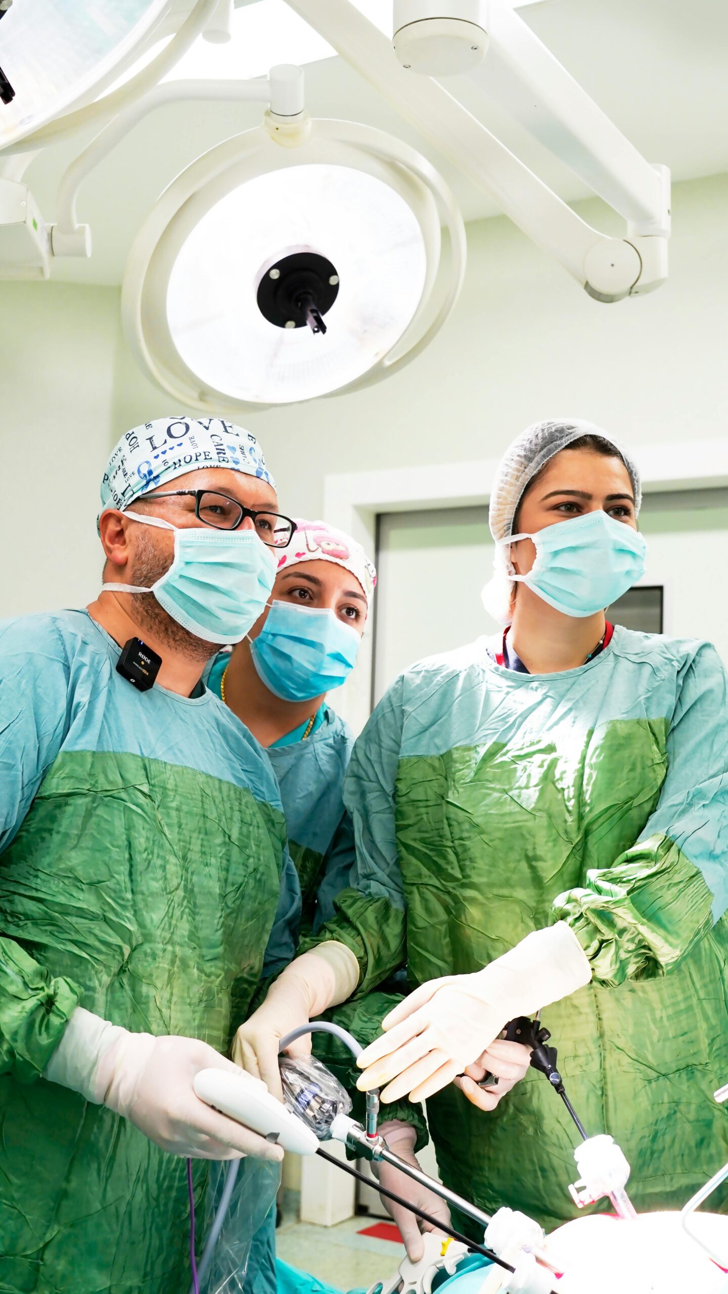 Surgical team of three focused doctors operating in a hospital in Elazığ, Türkiye.